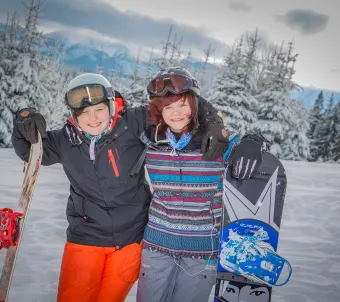 Dzieci na snowboardzie Vogue Travel